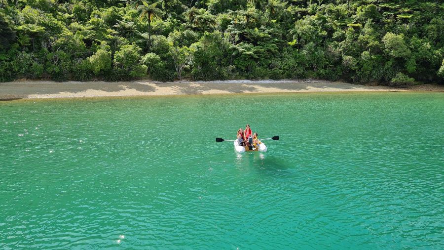 rowing to the beach in the tender